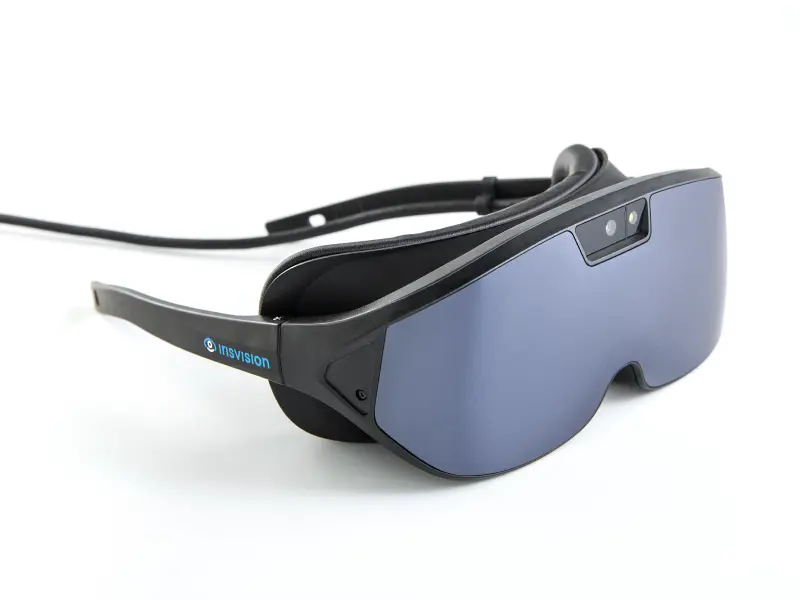 A person wearing the IrisVision Vista low-vision headset
